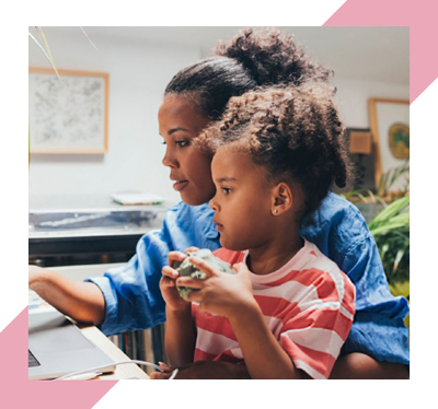 lady and little girl looking at a laptop